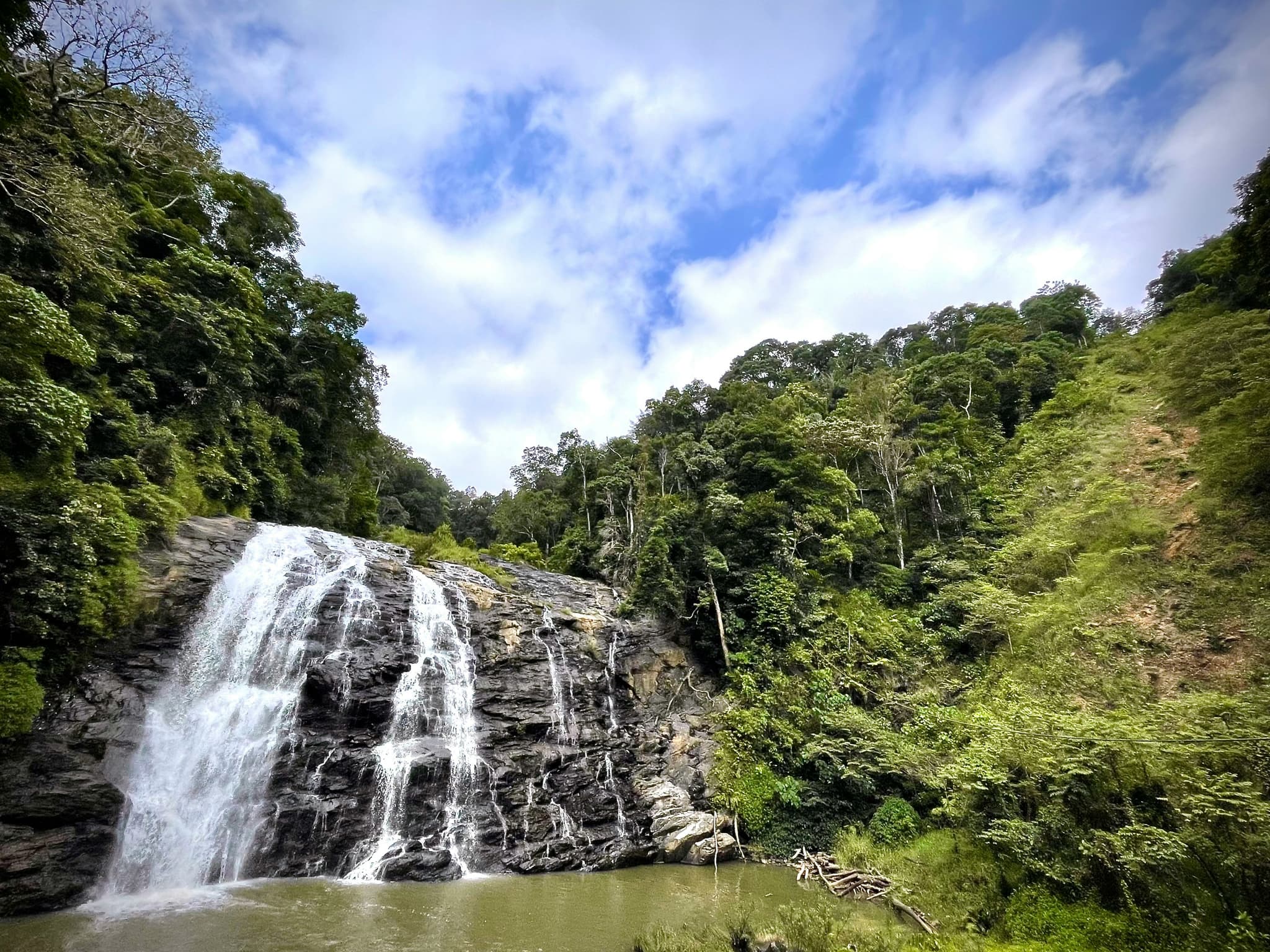 Abbey Falls cascading through coffee and spice plantation
