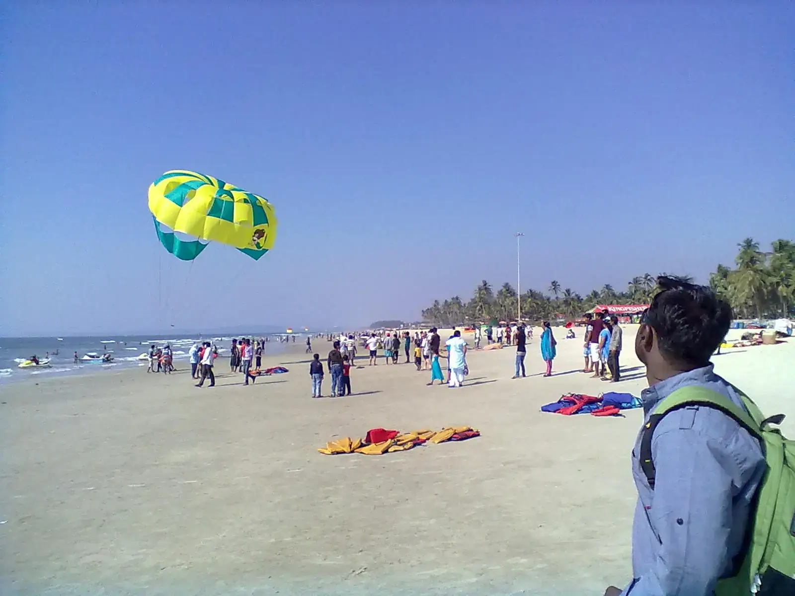 A parasail over a busy beach in Goa