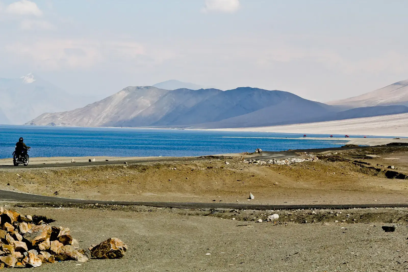 A motorcyclist on the road beside Pangong Tso, Ladakh