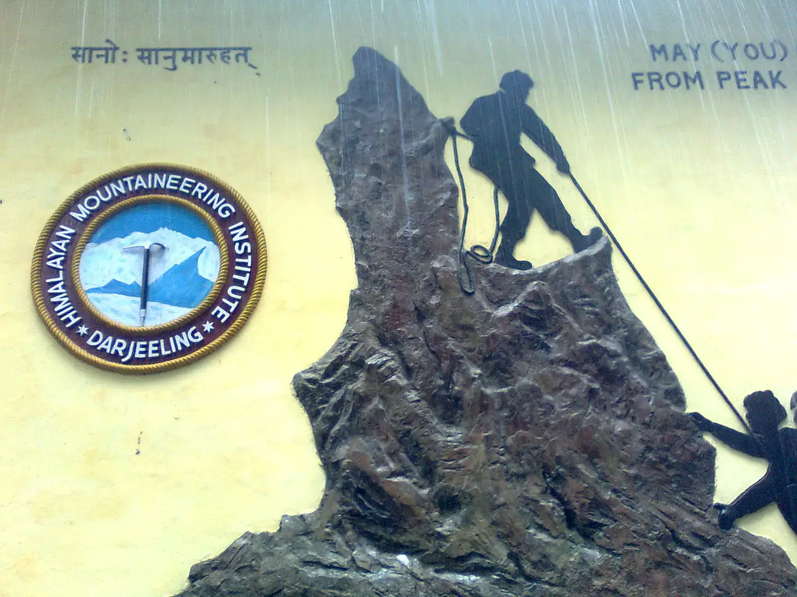 Climber sculpture and emblem at the Himalayan Mountaineering Institute, Darjeeling