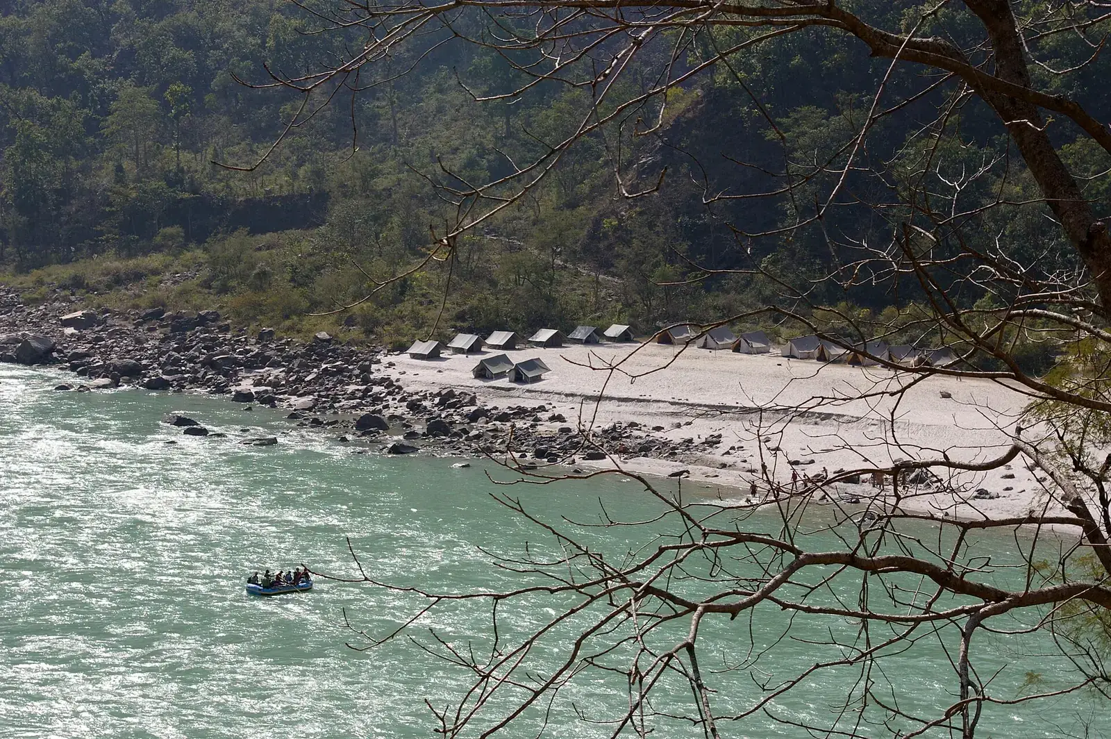 A raft on the Ganga beside a riverside camp near Rishikesh