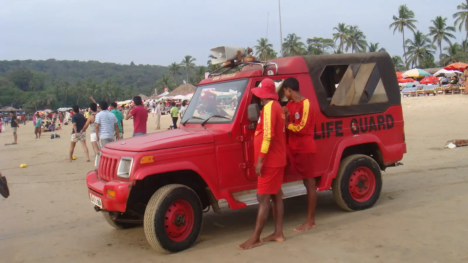 Lifeguards and their patrol vehicle on a Goa beach