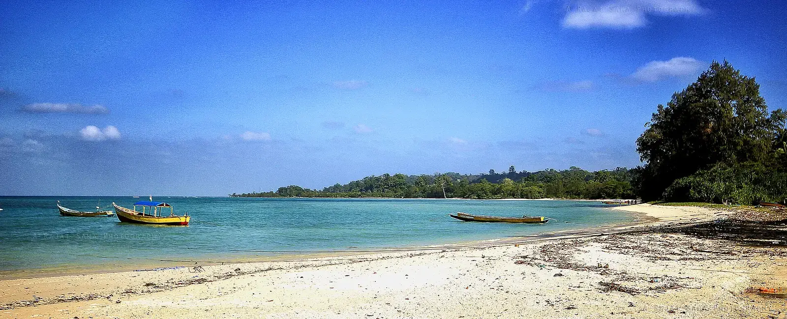 Boats in clear water off Neil Island (Shaheed Dweep), Andamans
