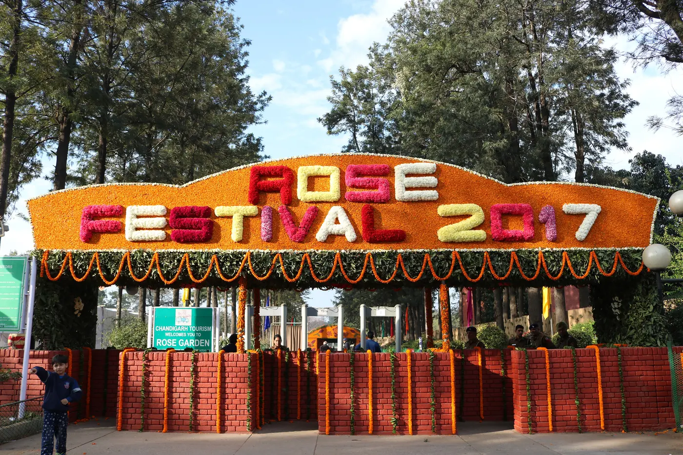 Flower-decorated entrance arch reading 'Rose Festival' at the Chandigarh Rose Festival held inside the Zakir Hussain Rose Garden
