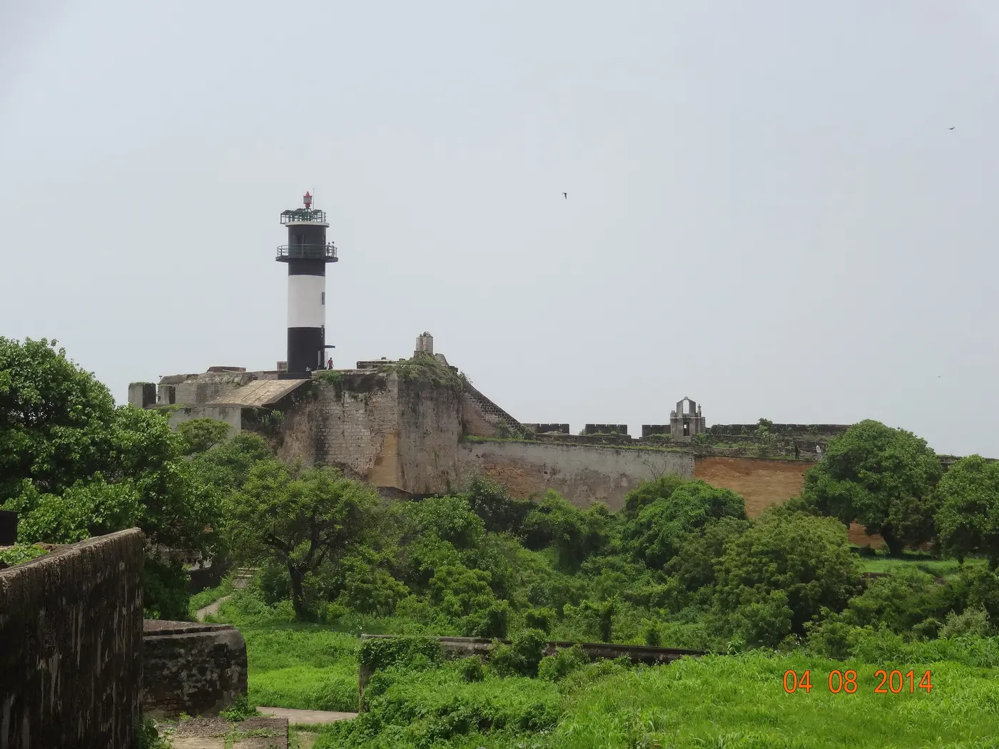 The lighthouse and sea-facing bastion of the 16th-century Diu Fort, a short drive from Gangeshwar Temple