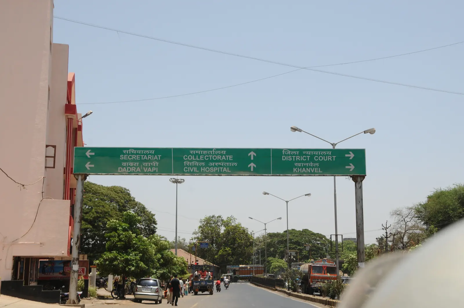 A road sign in Silvassa pointing toward Khanvel, the Collectorate, District Court and Secretariat