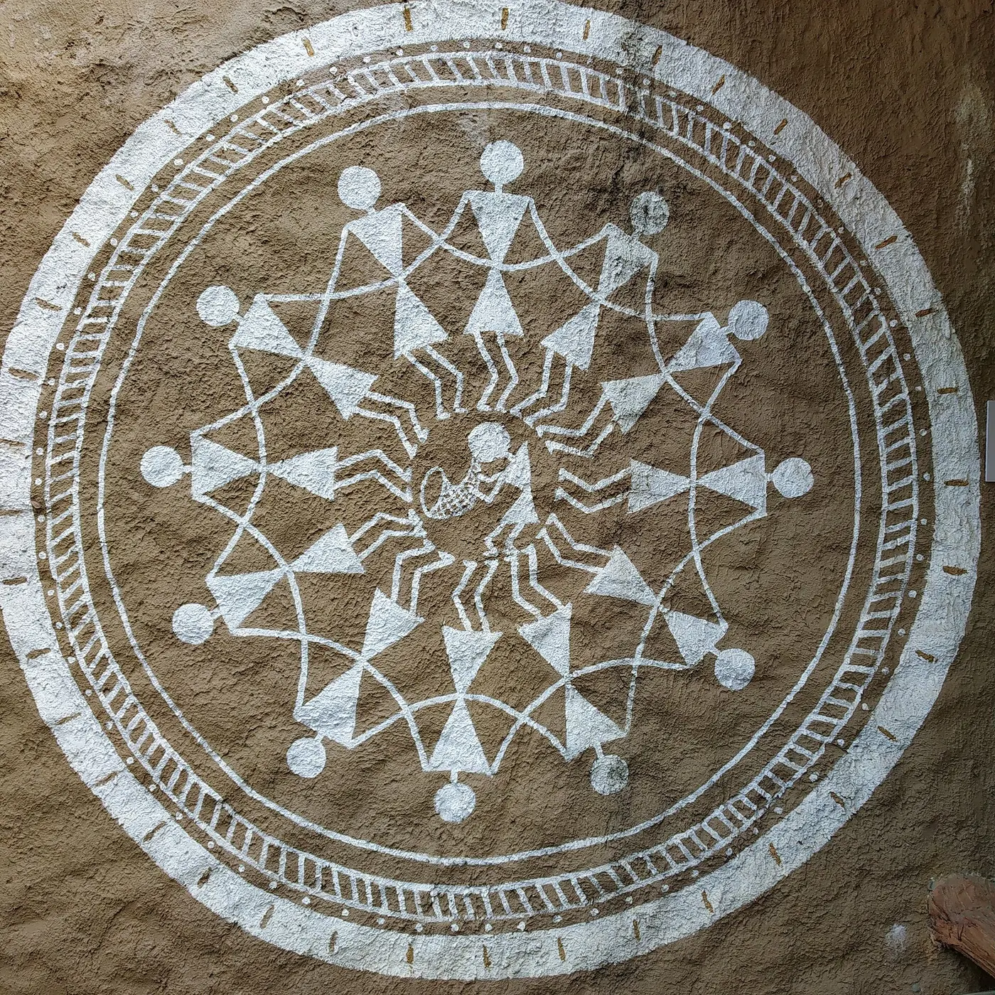 Warli painting on a mud wall