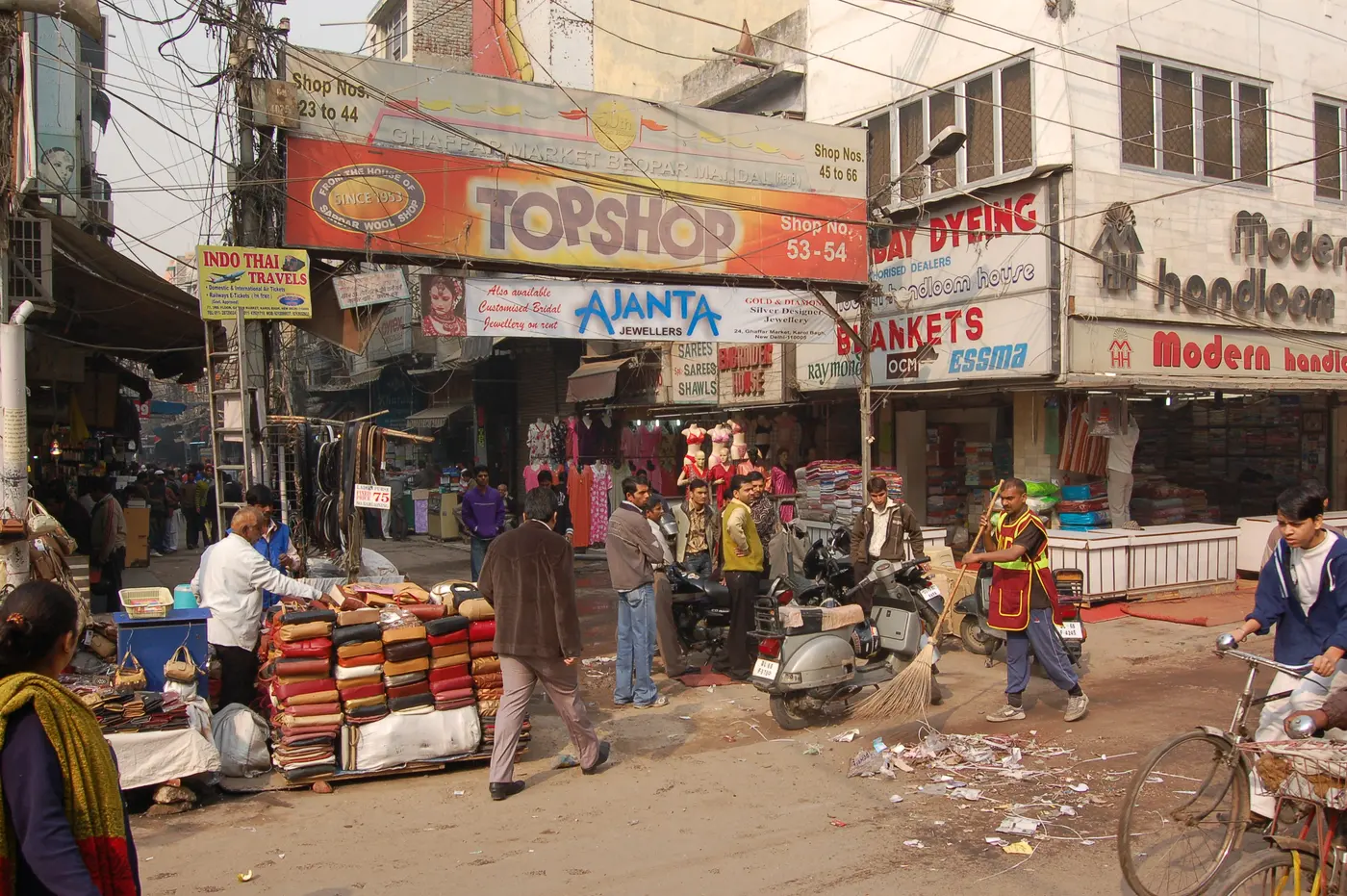 Clothing, footwear and jewellery storefronts lining a pedestrian stretch of Ajmal Khan Road, Karol Bagh