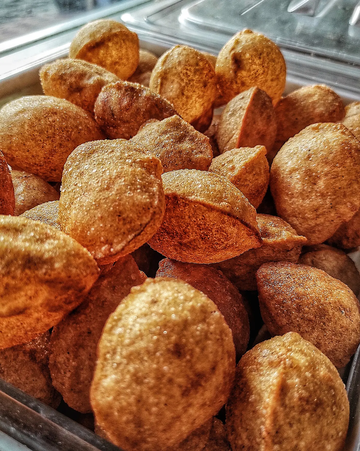 Freshly fried golgappe shells at a Delhi street food stall, the classic chaat snack found around Lajpat Nagar's Central Market