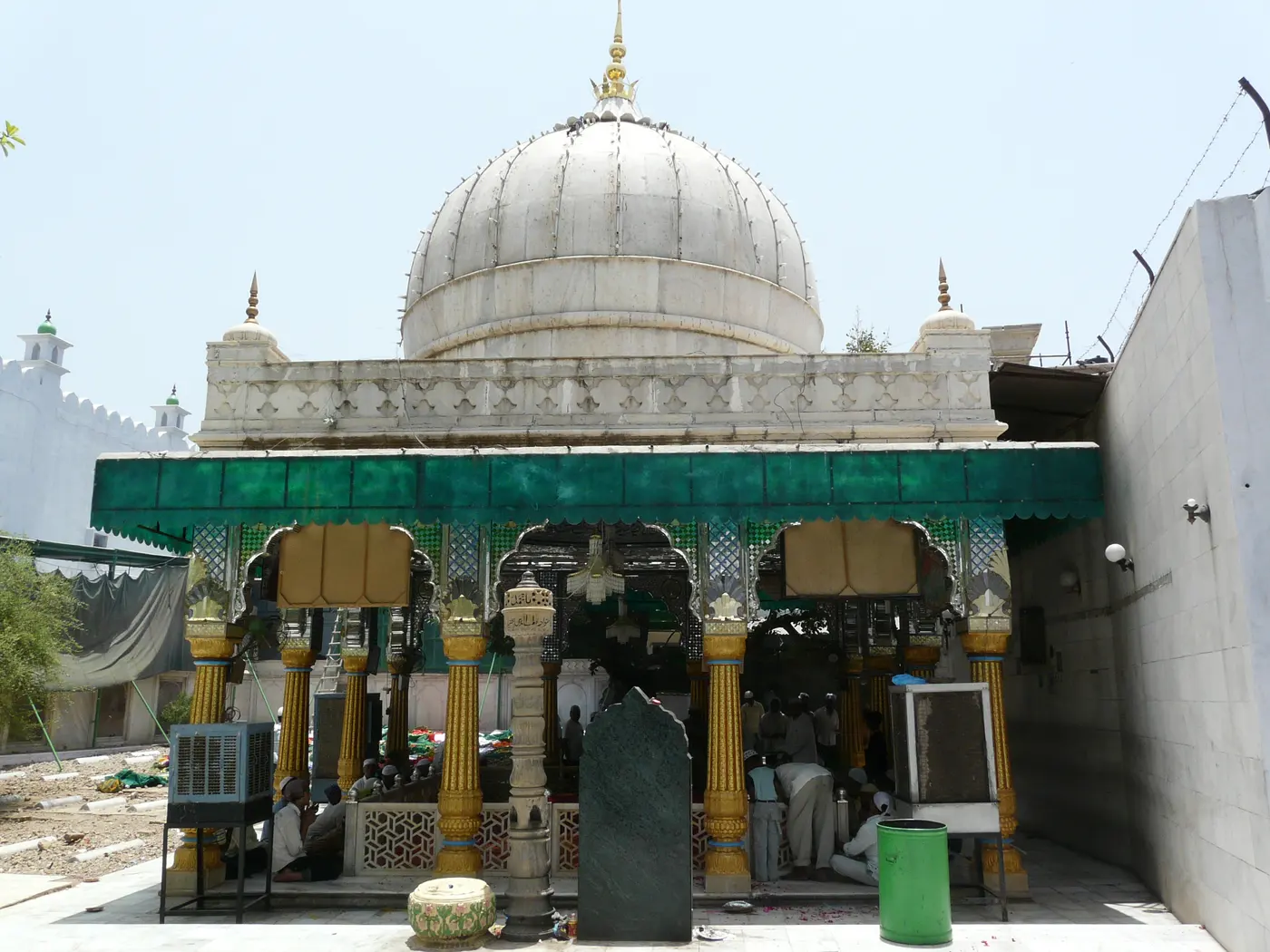 The white marble domed shrine of Dargah Qutub Sahib with devotees gathered inside, Mehrauli village