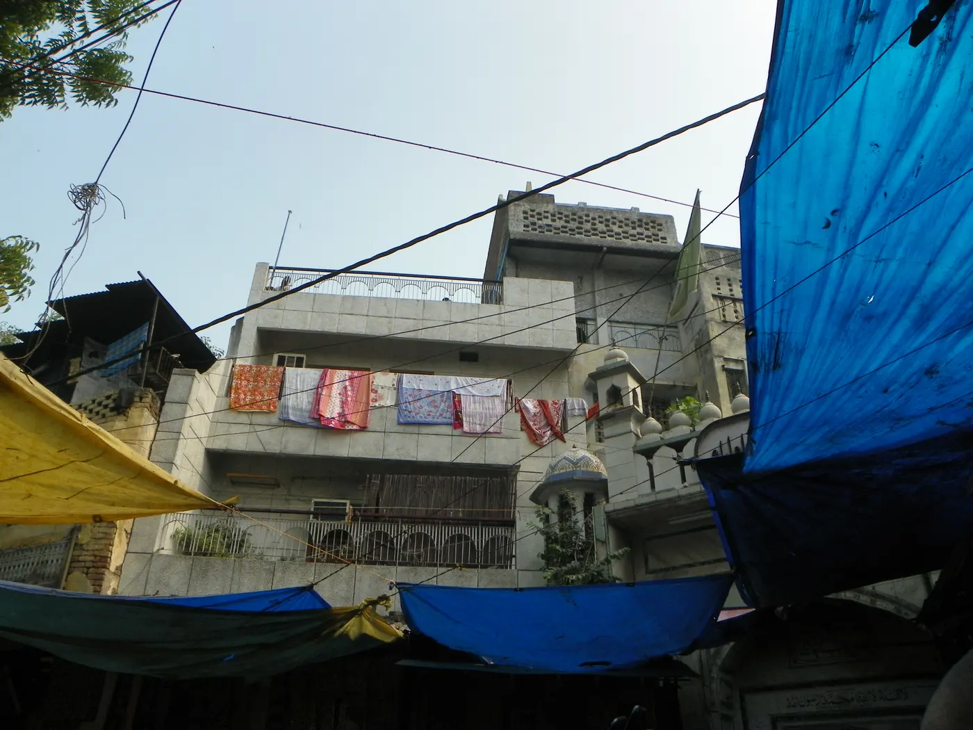 The narrow lane entrance leading into Nizamuddin Basti toward the dargah, Delhi