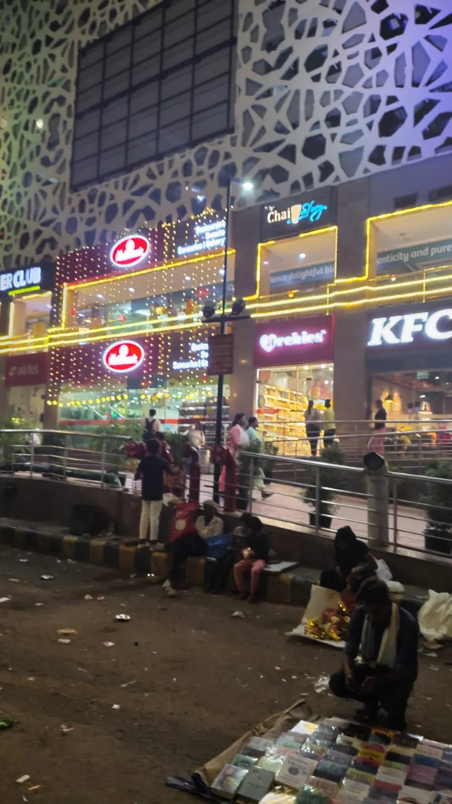 Haldiram's restaurant outlet lit up at night near Sarojini Nagar Market, a popular sit-down food option after shopping