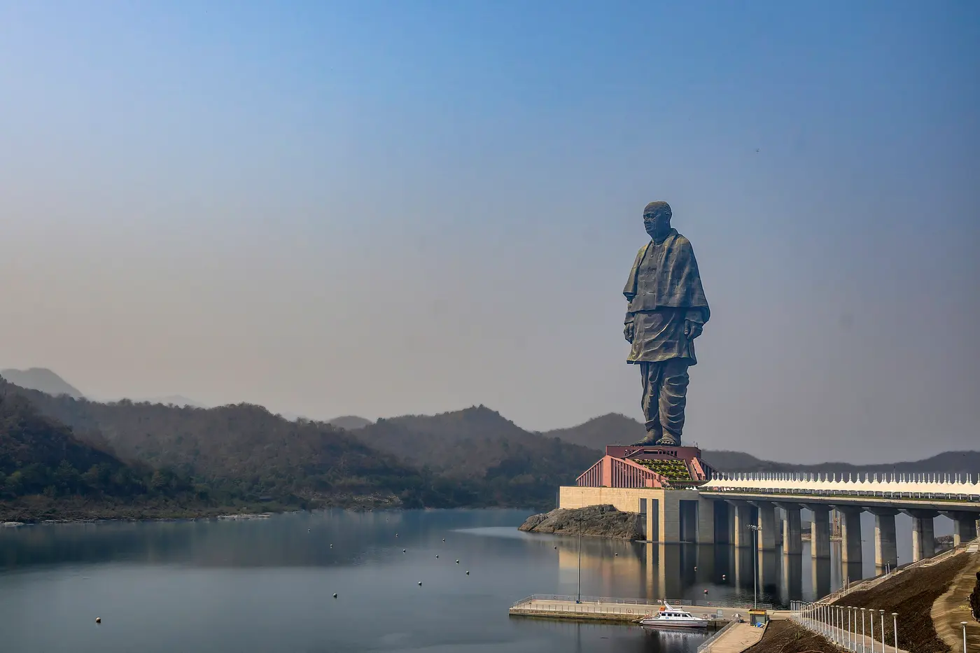 The Statue of Unity, the world's tallest statue, rising above the Narmada river reservoir near Kevadia