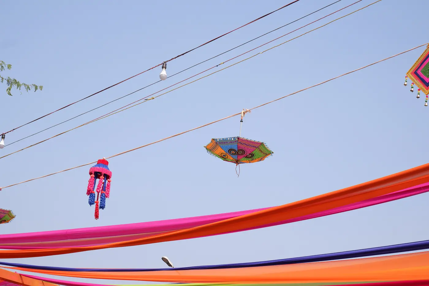 Colourful handicraft decorations and umbrellas at the International Surajkund Crafts Mela in Faridabad, Haryana