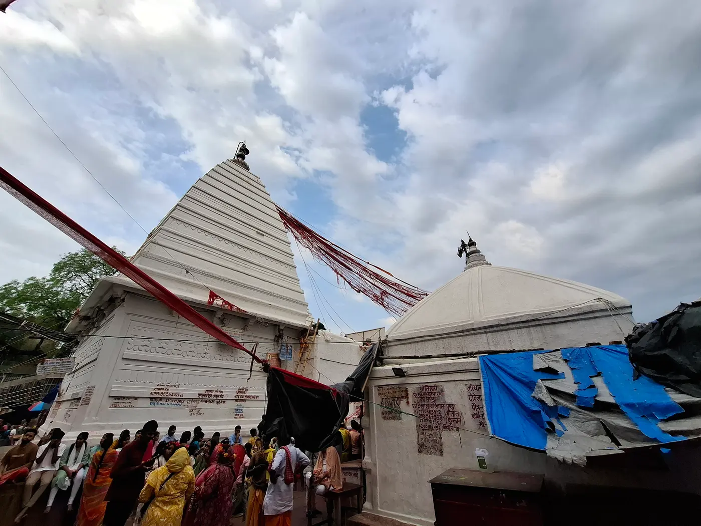 Pilgrims gathered at the white pyramidal shikhara of the Baidyanath Jyotirlinga temple, Deoghar
