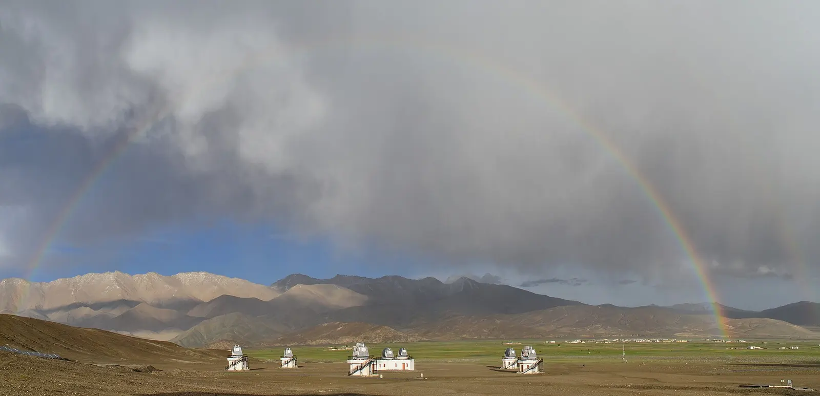 A rainbow over the telescope domes of the Indian Astronomical Observatory, Hanle