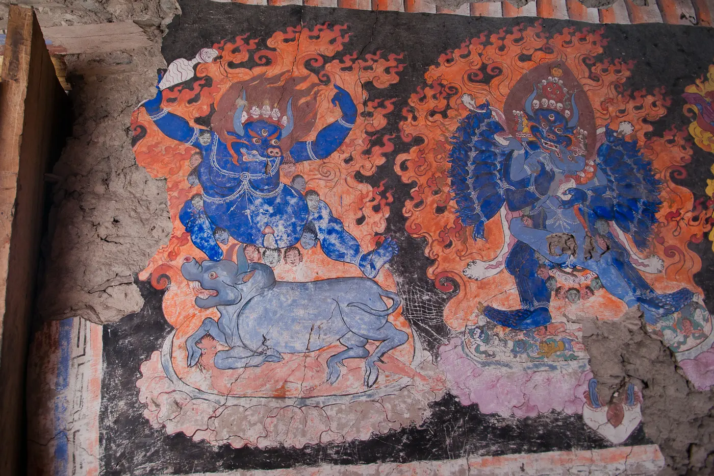 Faded wall murals depicting wrathful deities inside Ensa Gompa, Nubra Valley