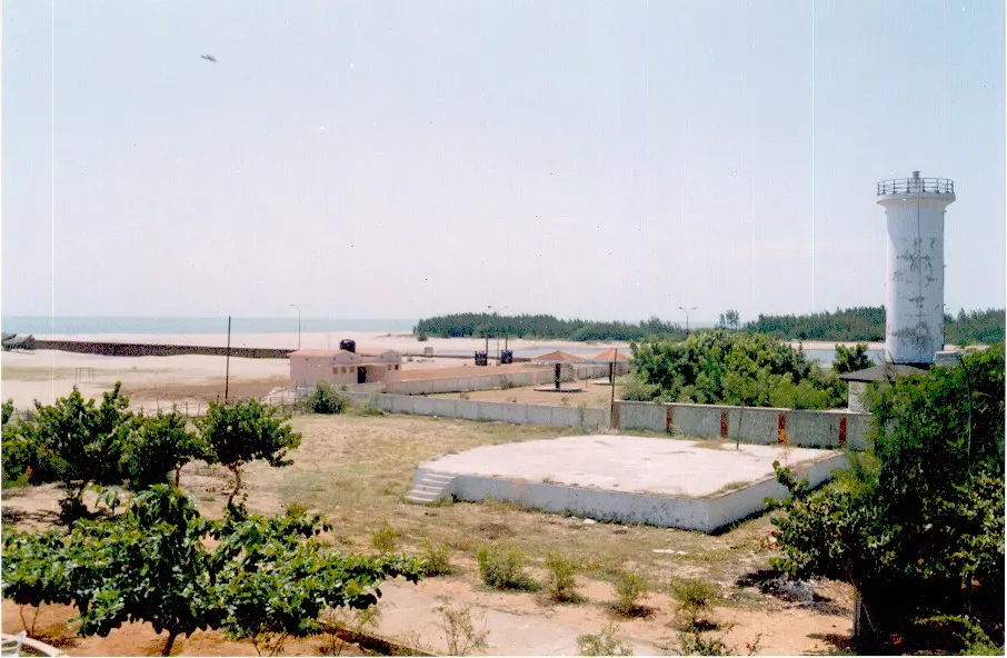 Karaikal Lighthouse rising above the beach and coastline at the edge of town