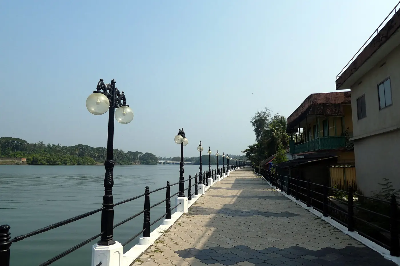 The Mahe Walkway riverfront promenade lined with lamp posts along the Mahe River