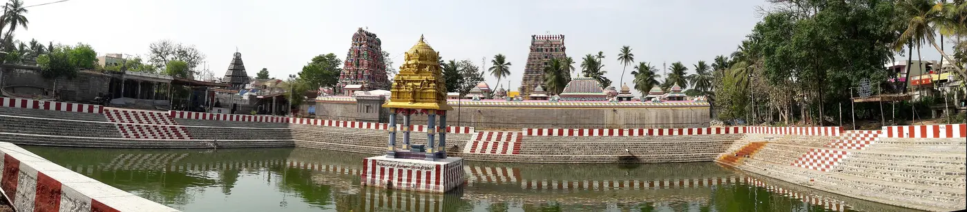 Villianur Temple's gopurams reflected in the temple tank