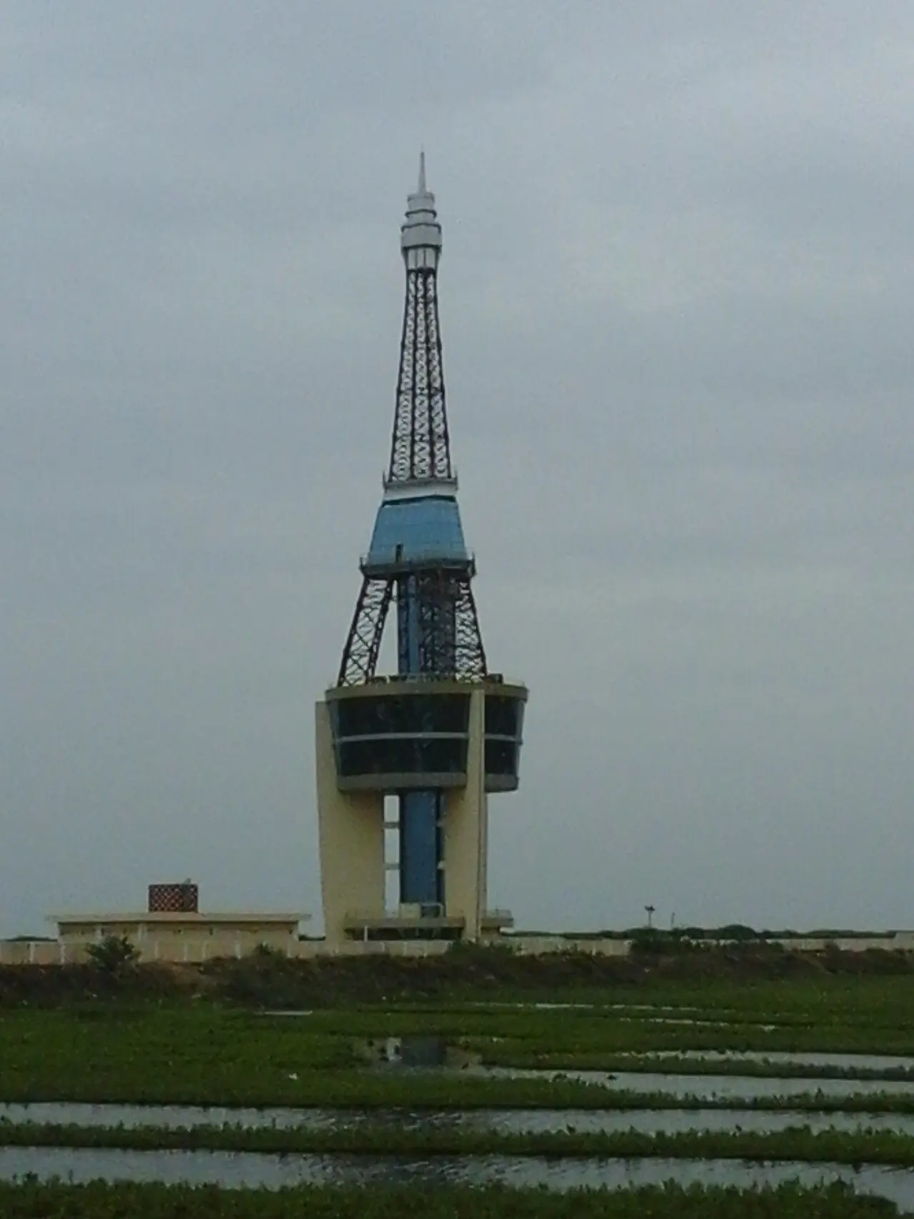 Yanam Tower, a distinctive Eiffel Tower-style observation structure rising above the town's paddy fields