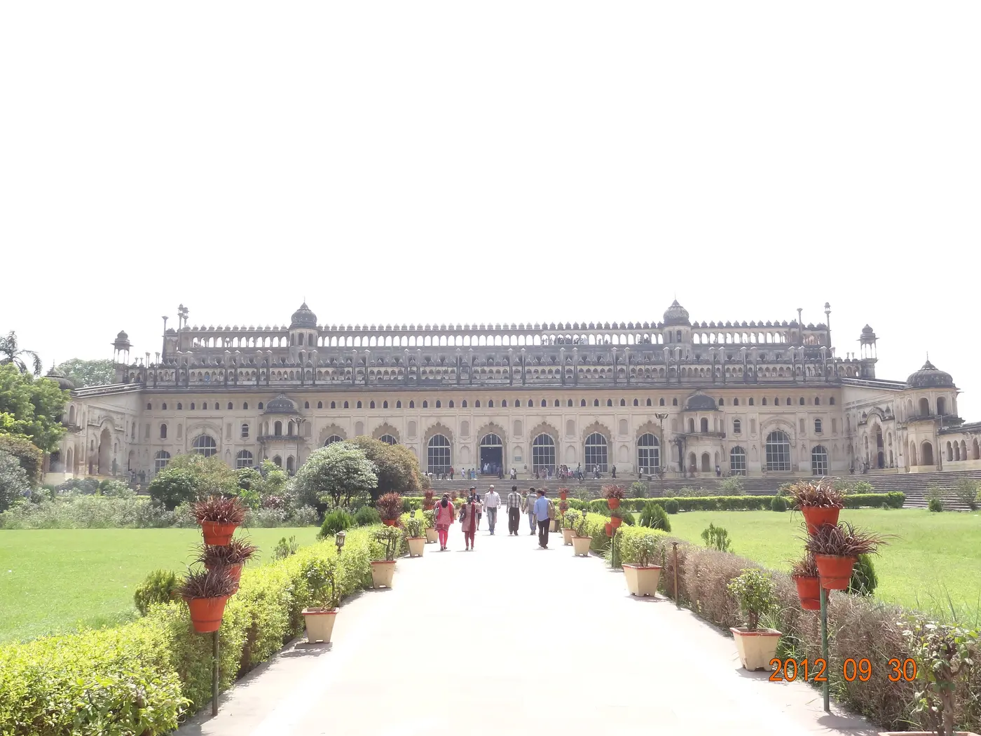 The grand sandstone facade of the Bara Imambara, Lucknow, seen across its formal garden approach