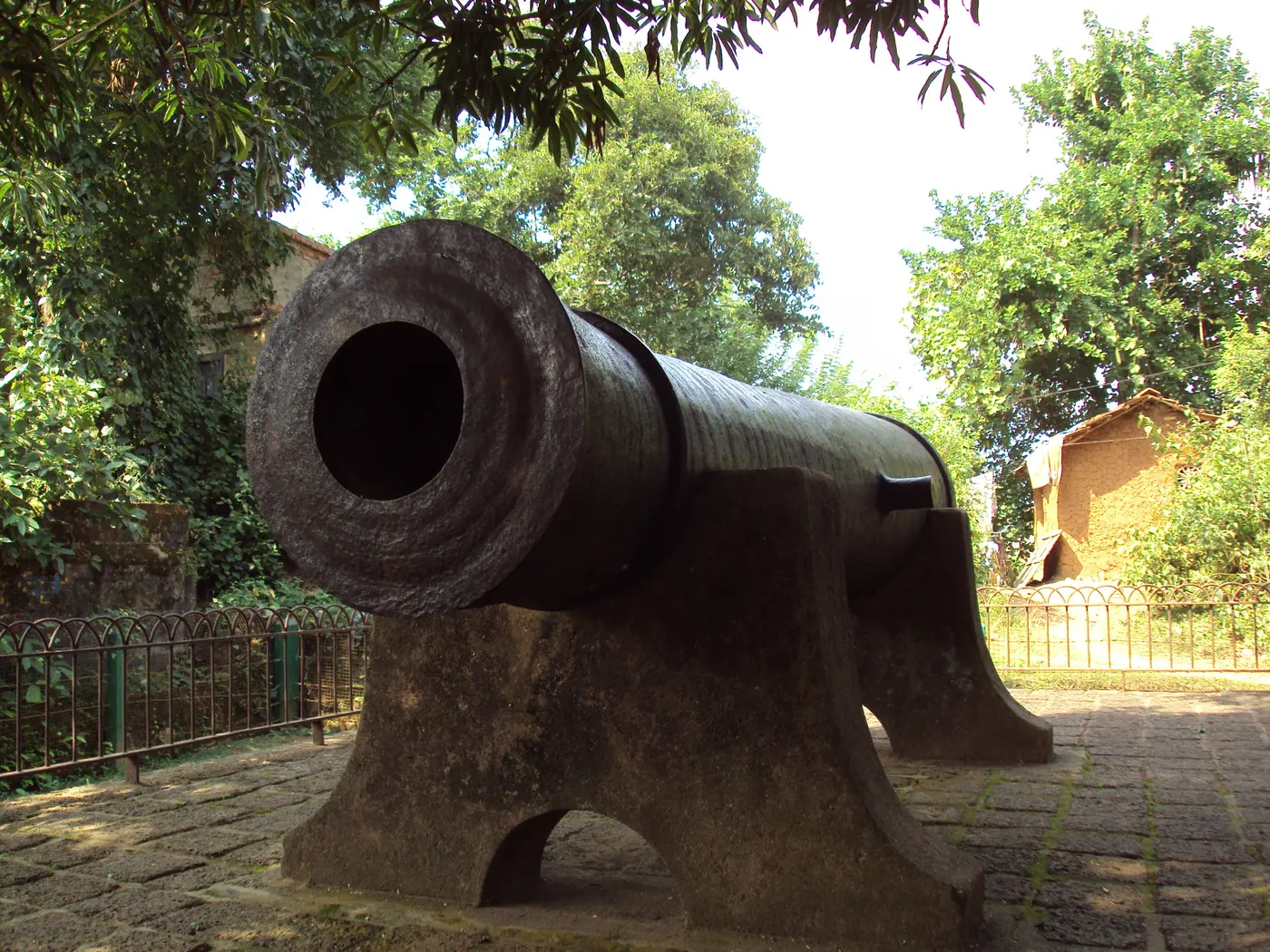 The massive 17th-century iron Dalmadal Cannon on display near the temple cluster in Bishnupur