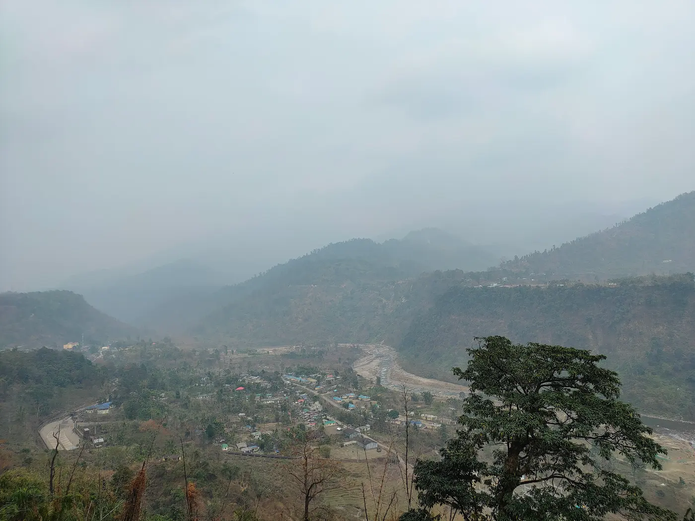 The misty Jaldhaka river valley near the Bindu border village on the Dooars' edge with Bhutan