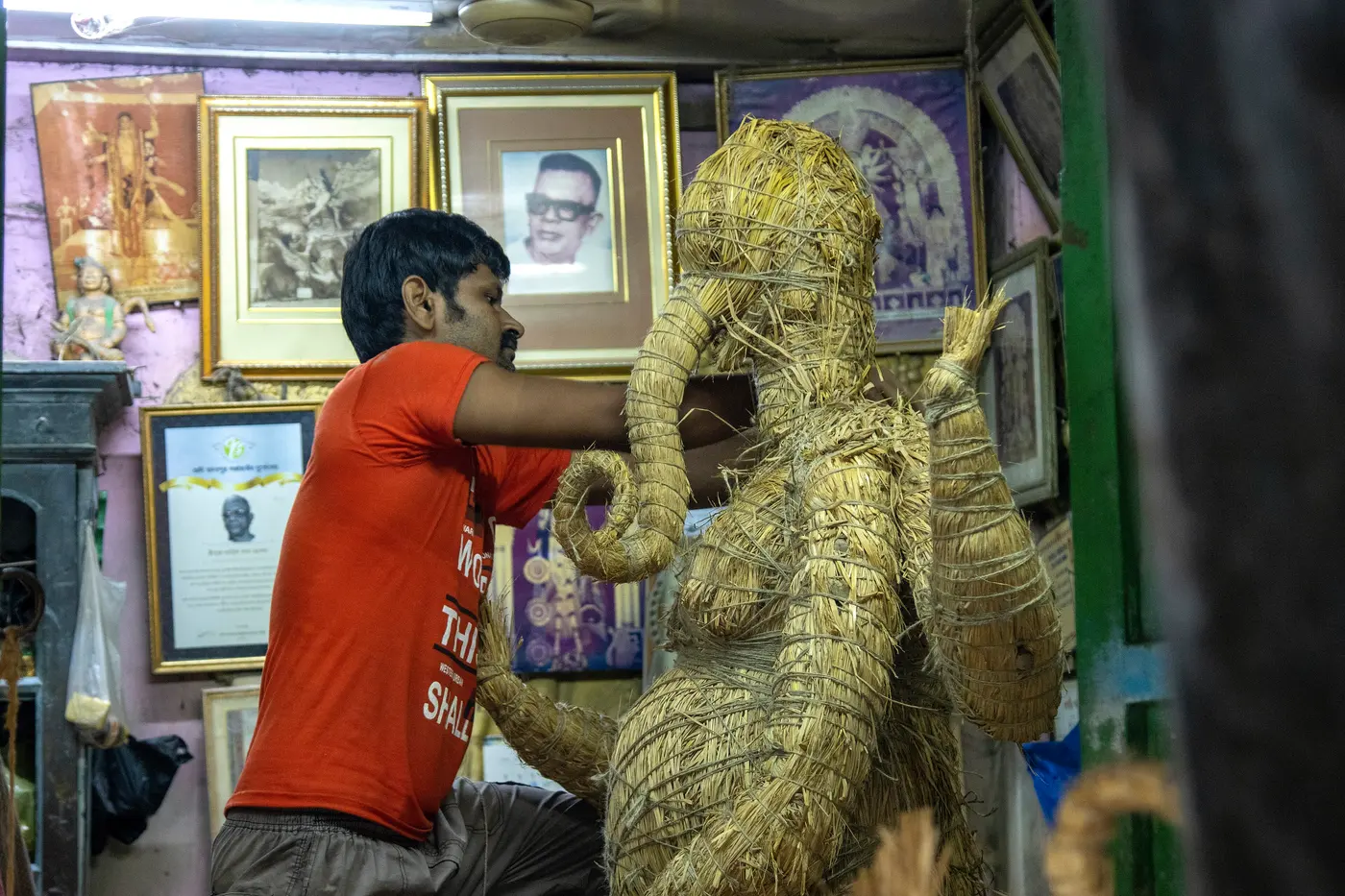 Clay idols being made in a Kumartuli workshop