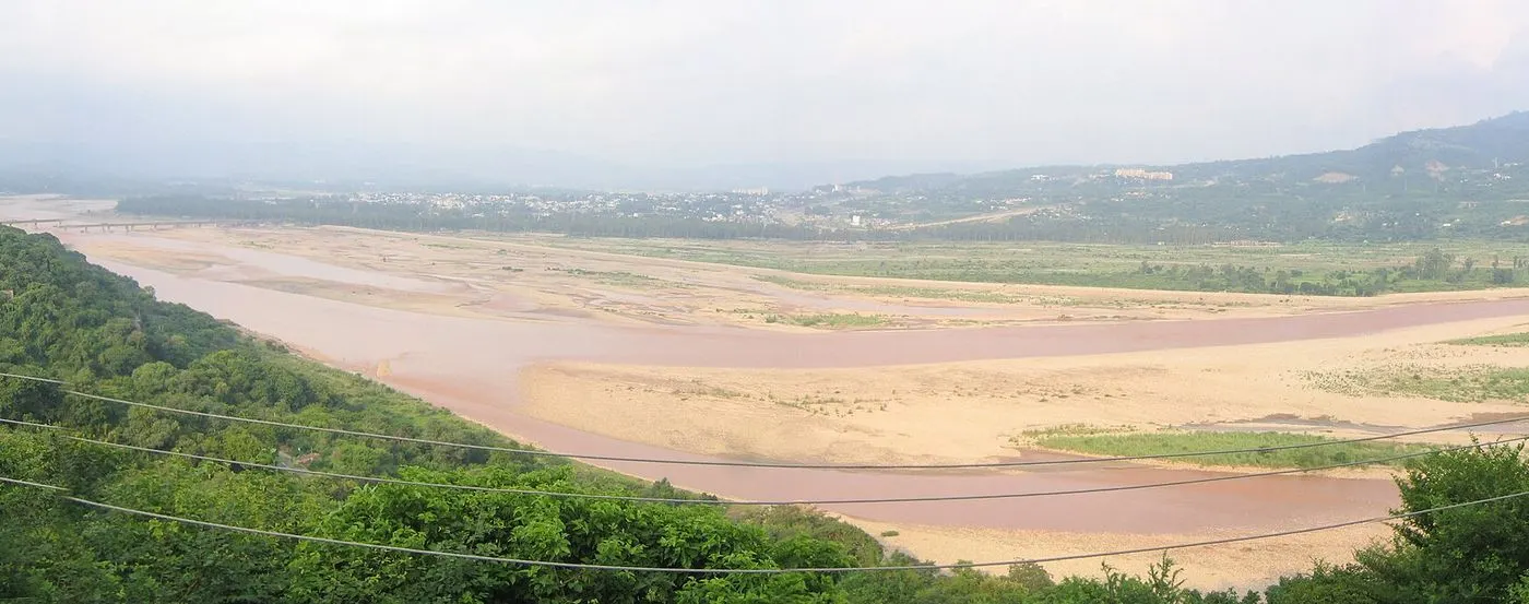 The Tawi River winding through its wide floodplain below Jammu city, seen from Amar Mahal Palace