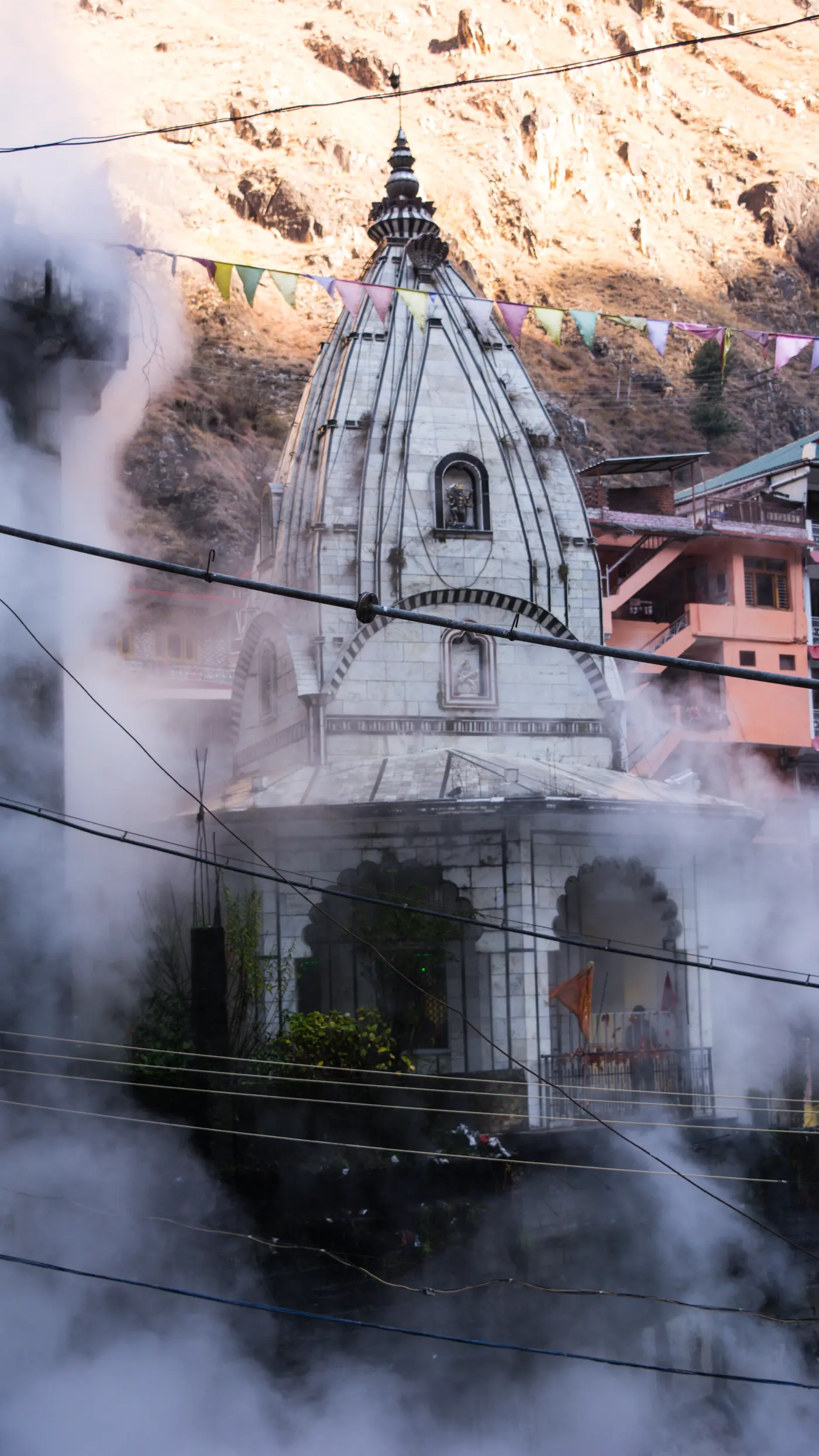 Manikaran Sahib gurudwara with steam rising from hot springs