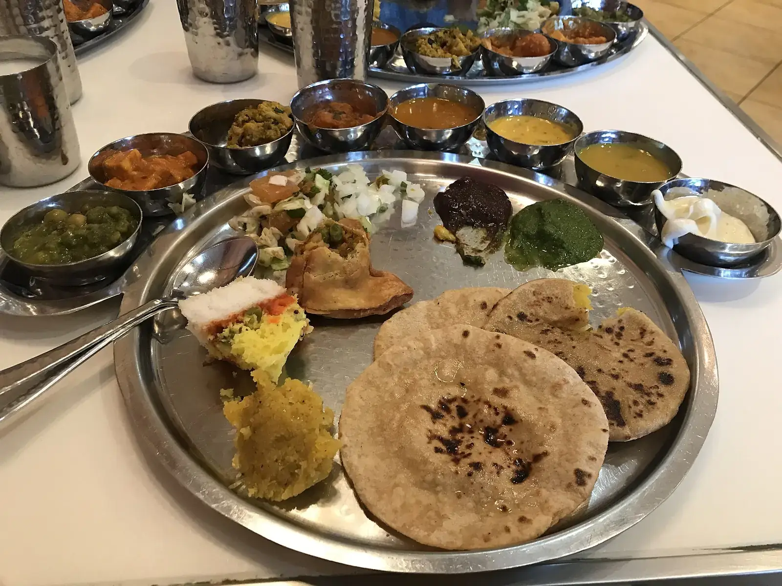 An Indian vegetarian thali with breads, dal and vegetables