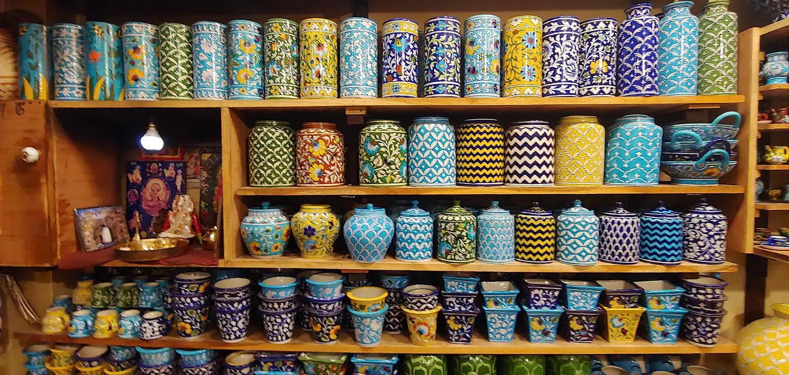 Shelves of Jaipur blue pottery in a craft shop