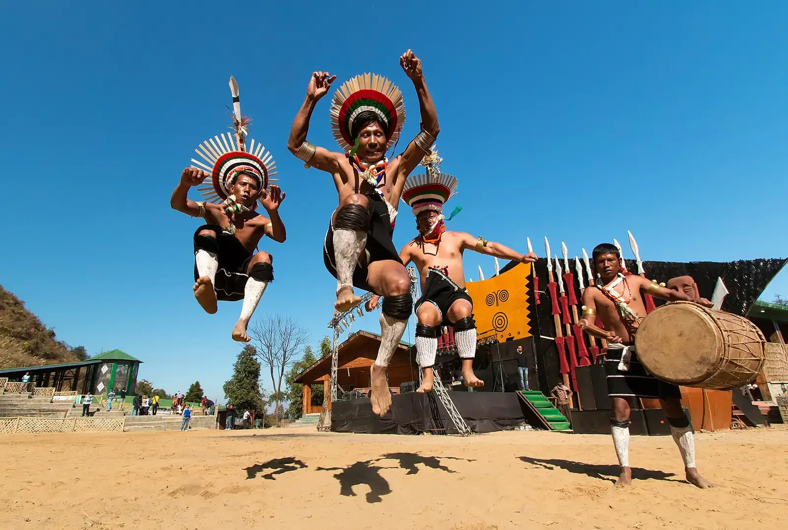 Naga dancers leaping during the Hornbill Festival at Kisama, Nagaland
