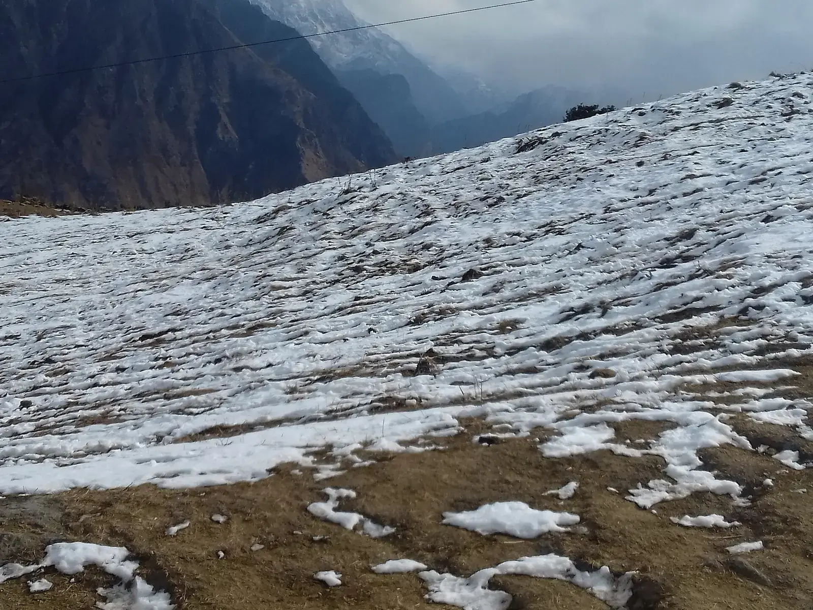 Patchy snow on the slopes at Auli, Uttarakhand
