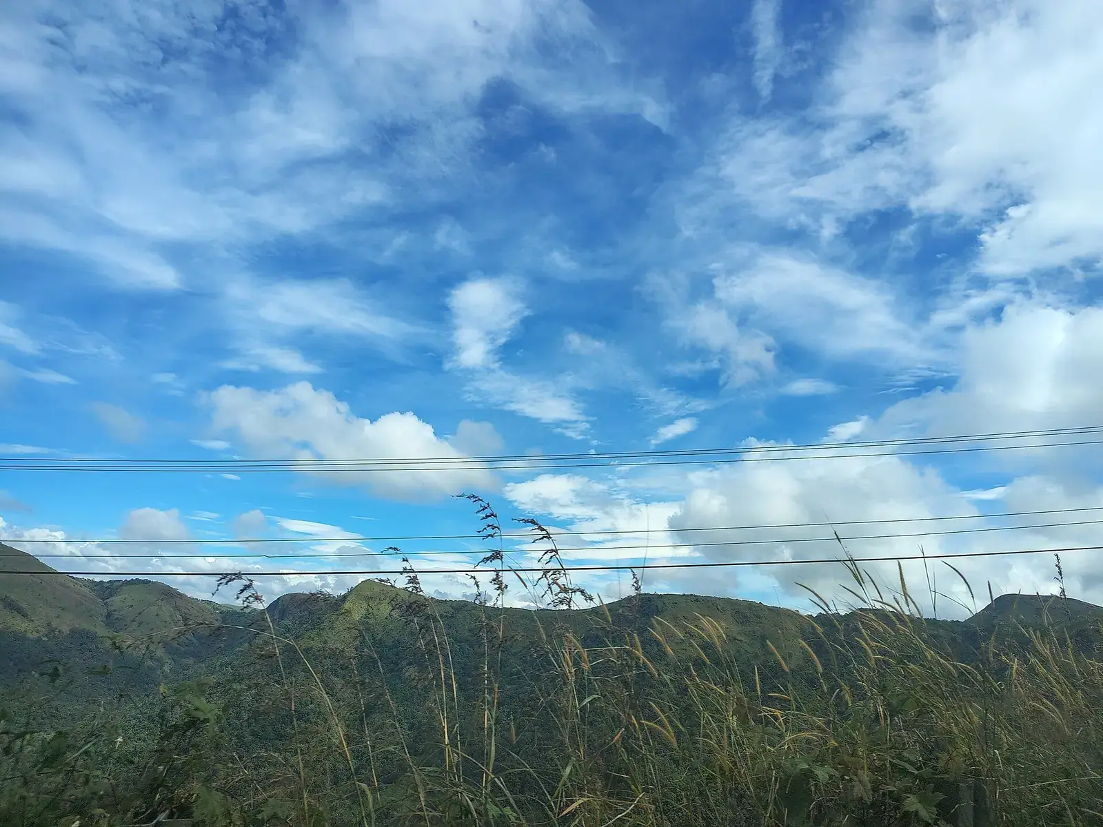 Grassy hills under clouds near Vagamon, Idukki, Kerala