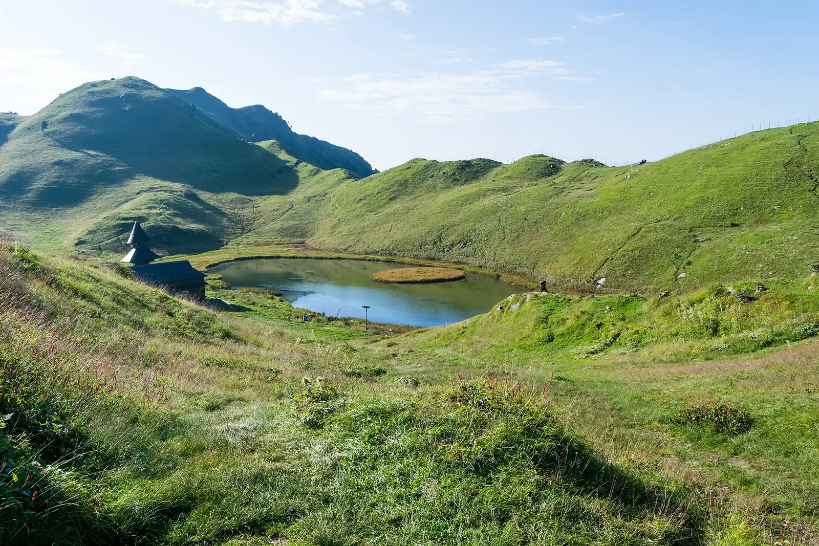 Prashar Lake in its grassy bowl above the Mandi hills, Himachal Pradesh