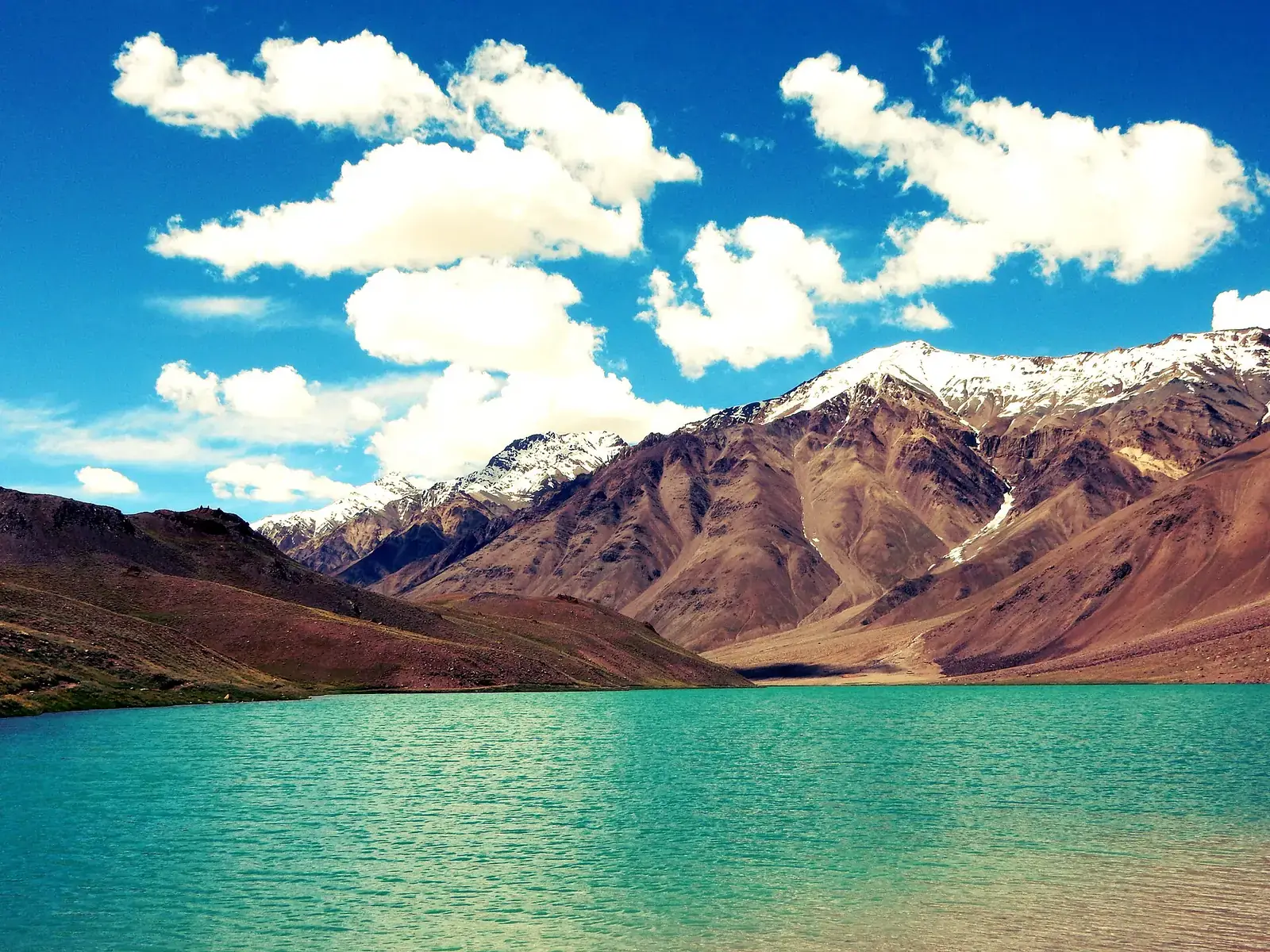 Chandratal lake below the peaks of the Spiti region, Himachal Pradesh