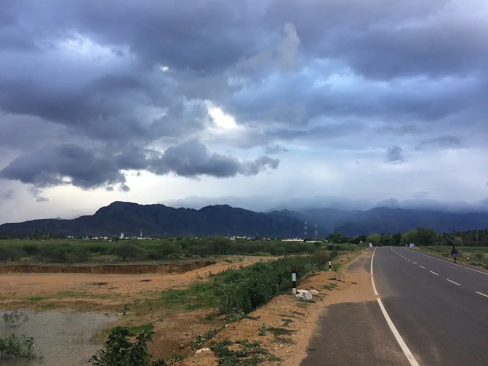 Monsoon clouds over the Western Ghats and a highway below