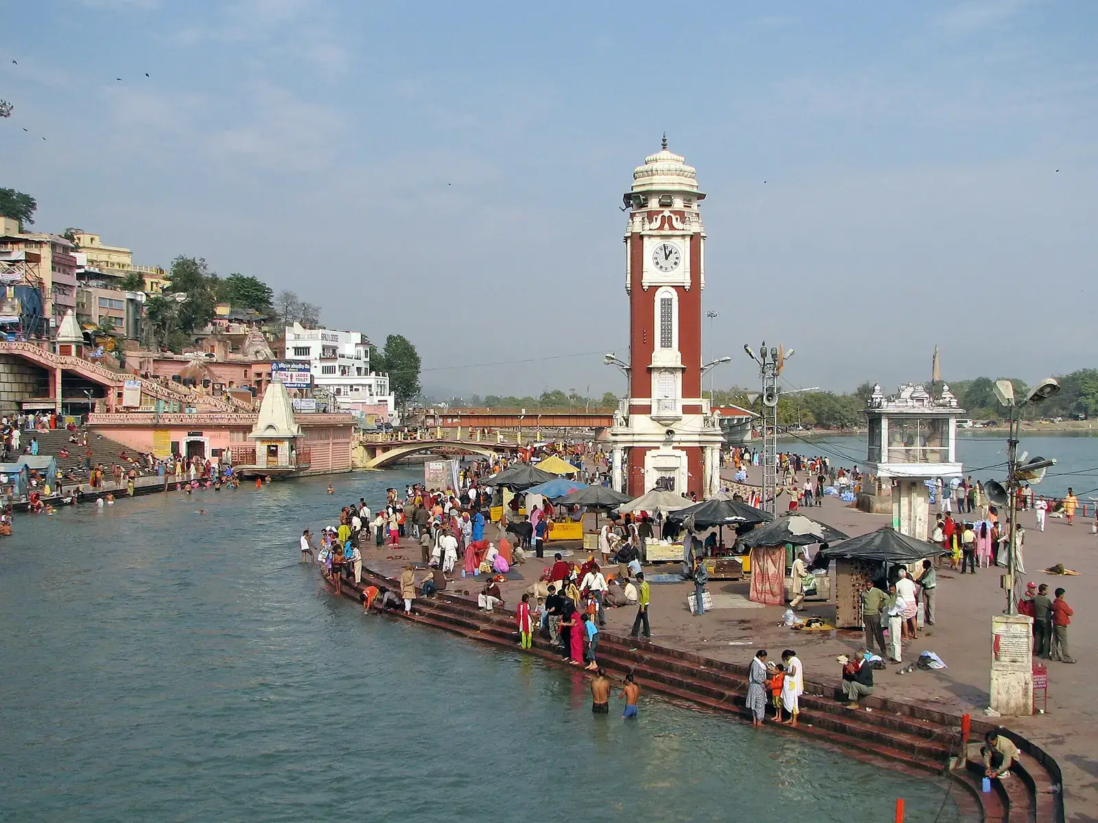 Pilgrims at Har ki Pauri with its clock tower on the Ganga, Haridwar