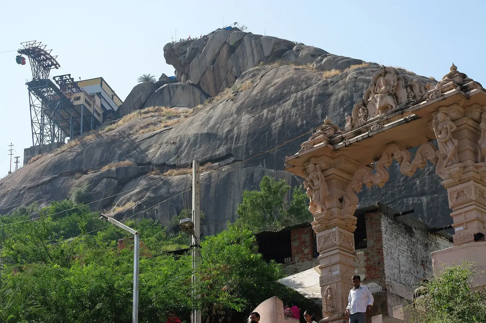 Gabbar hill at Ambaji with its ropeway and a carved gateway, Gujarat